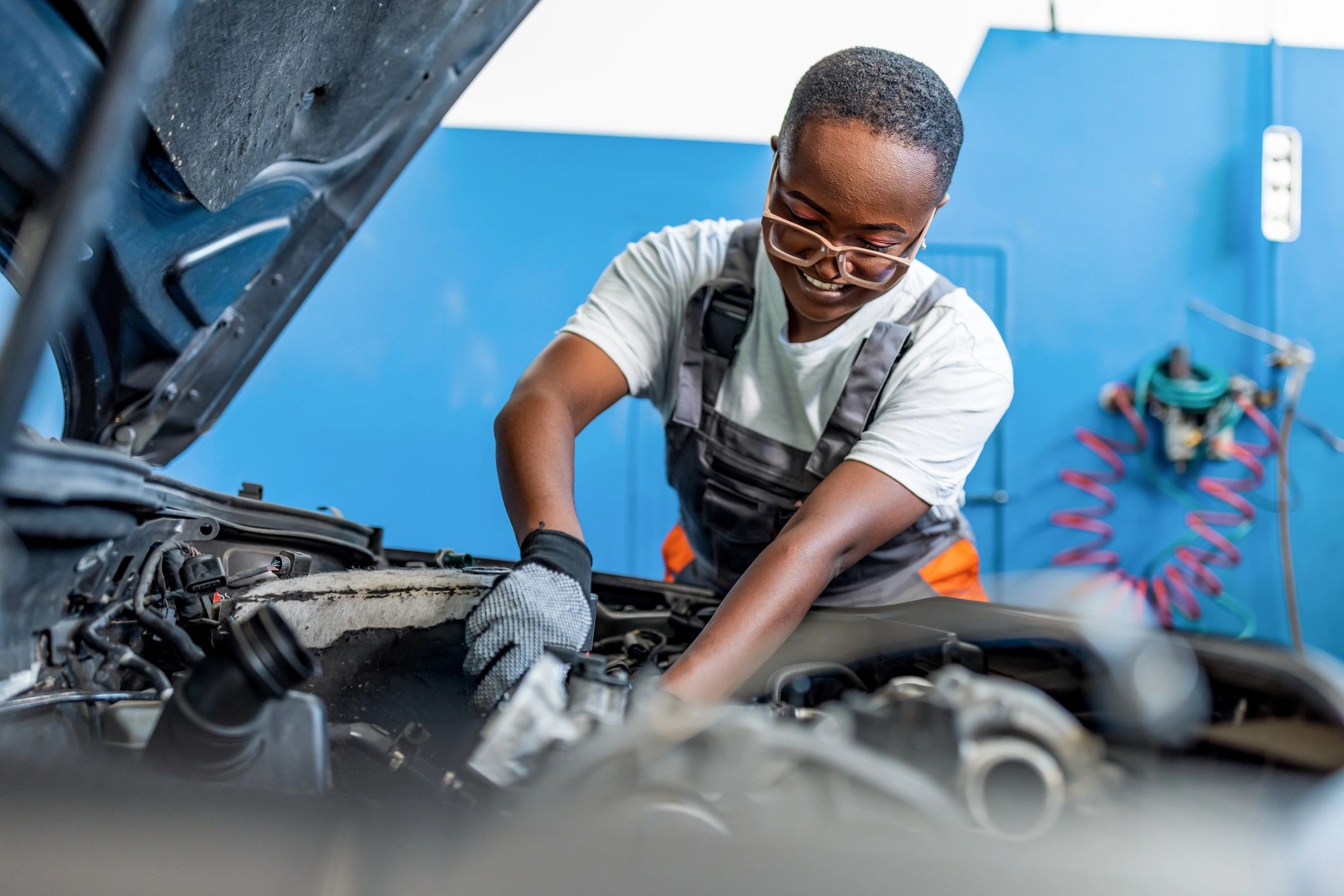 ASE certified mechanic working on car