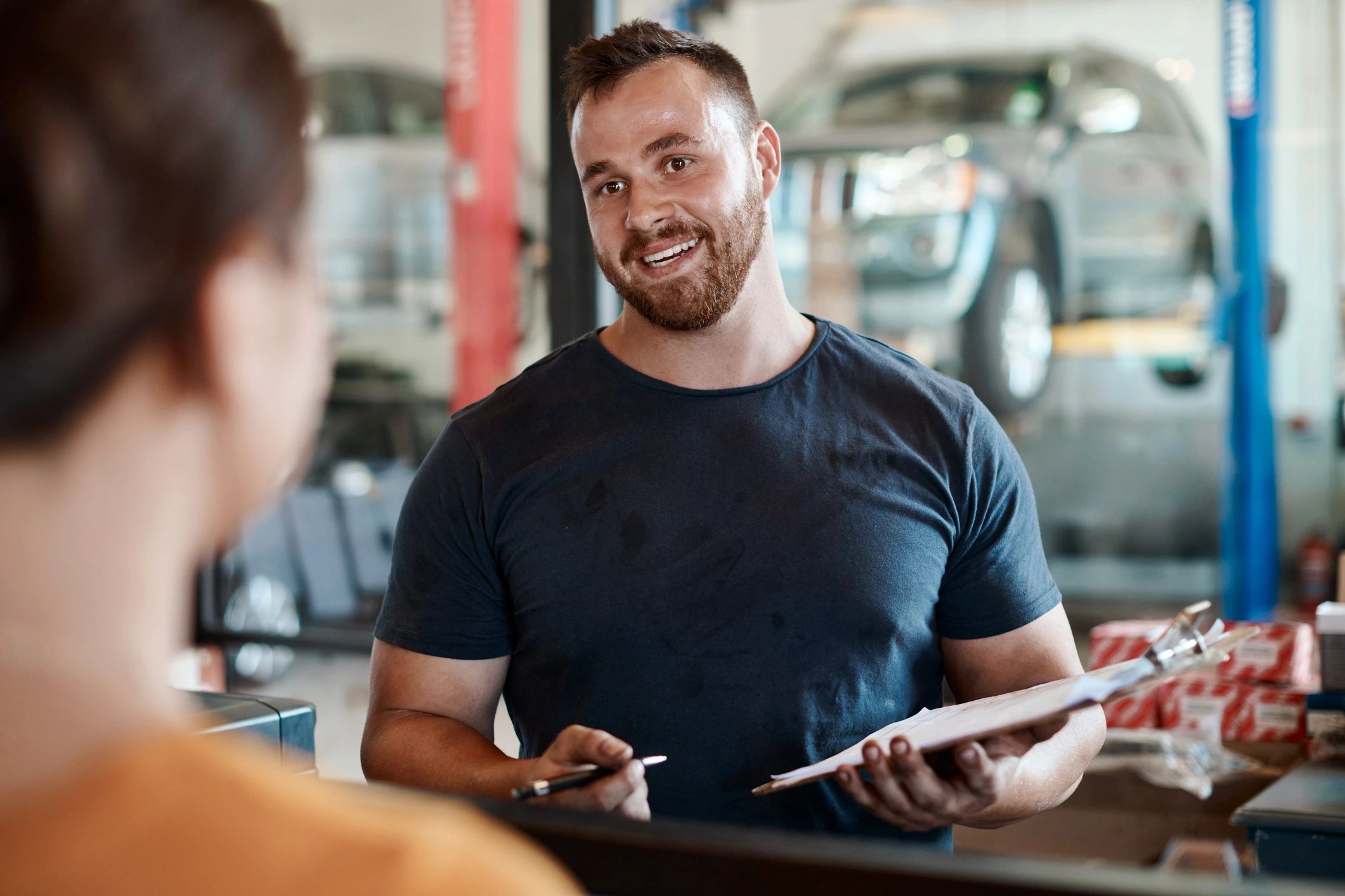 Happy customer at auto repair shop