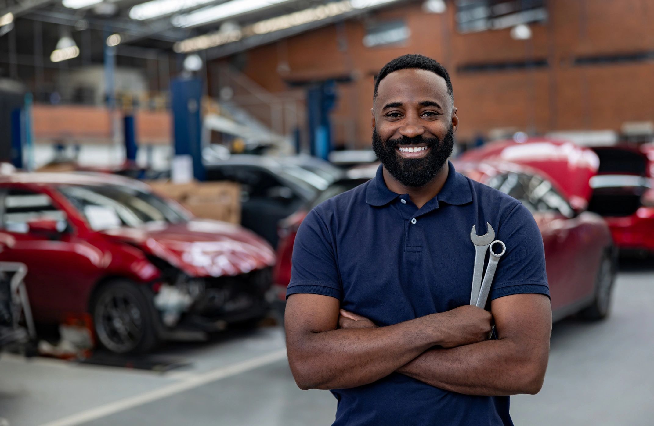 happy customer with car at auto shop