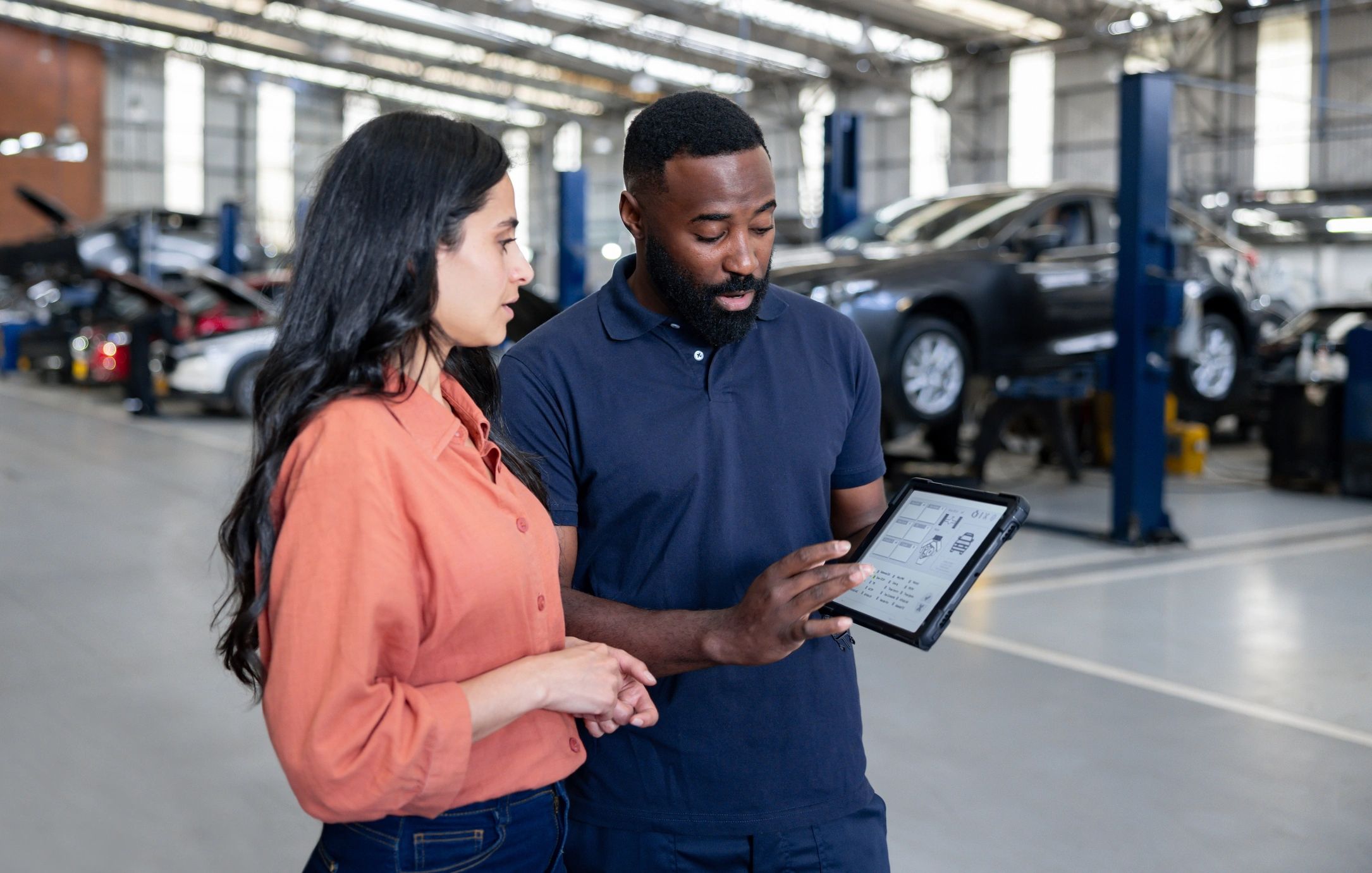 Customer talking to auto service advisor