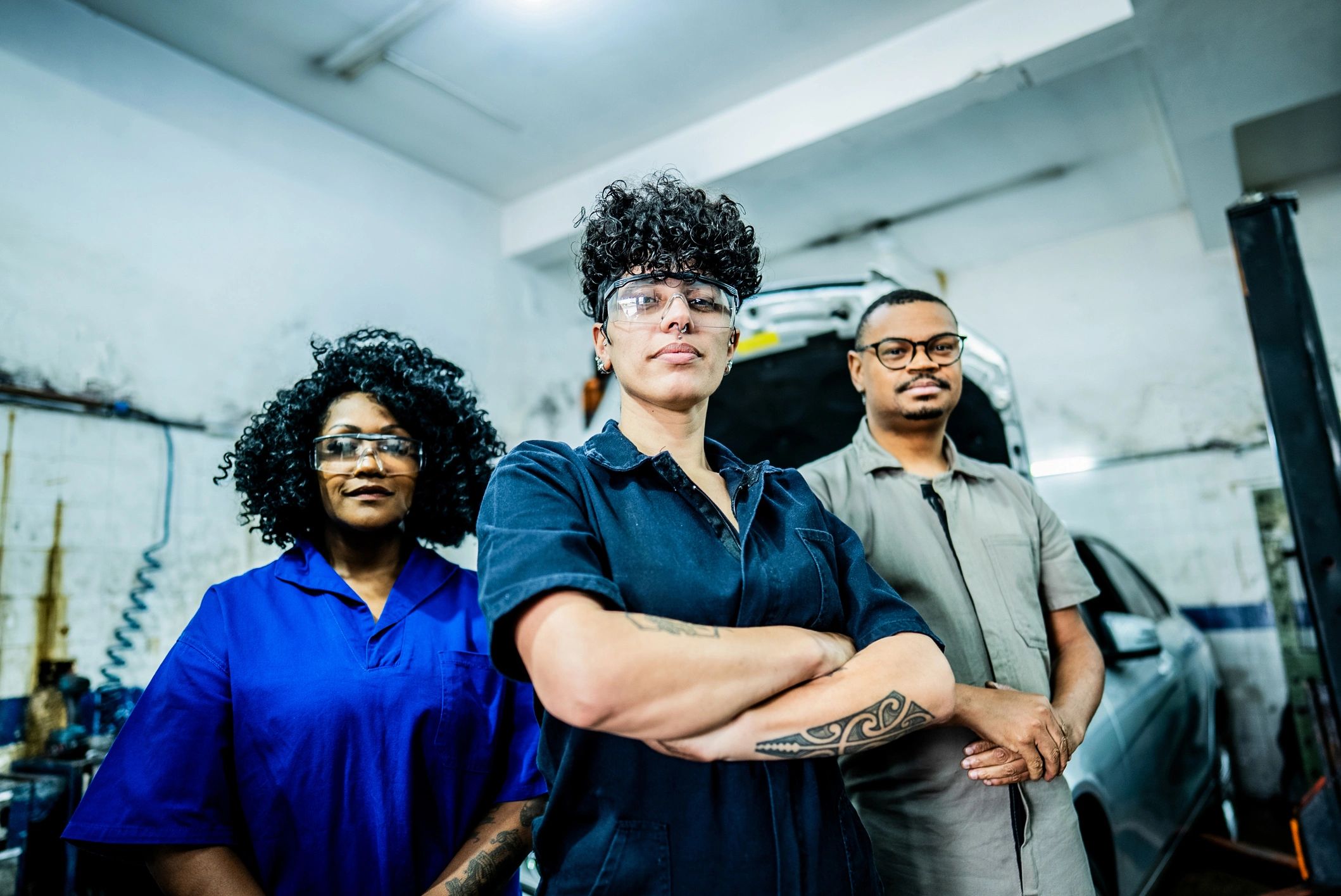 Team of mechanics in auto repair shop