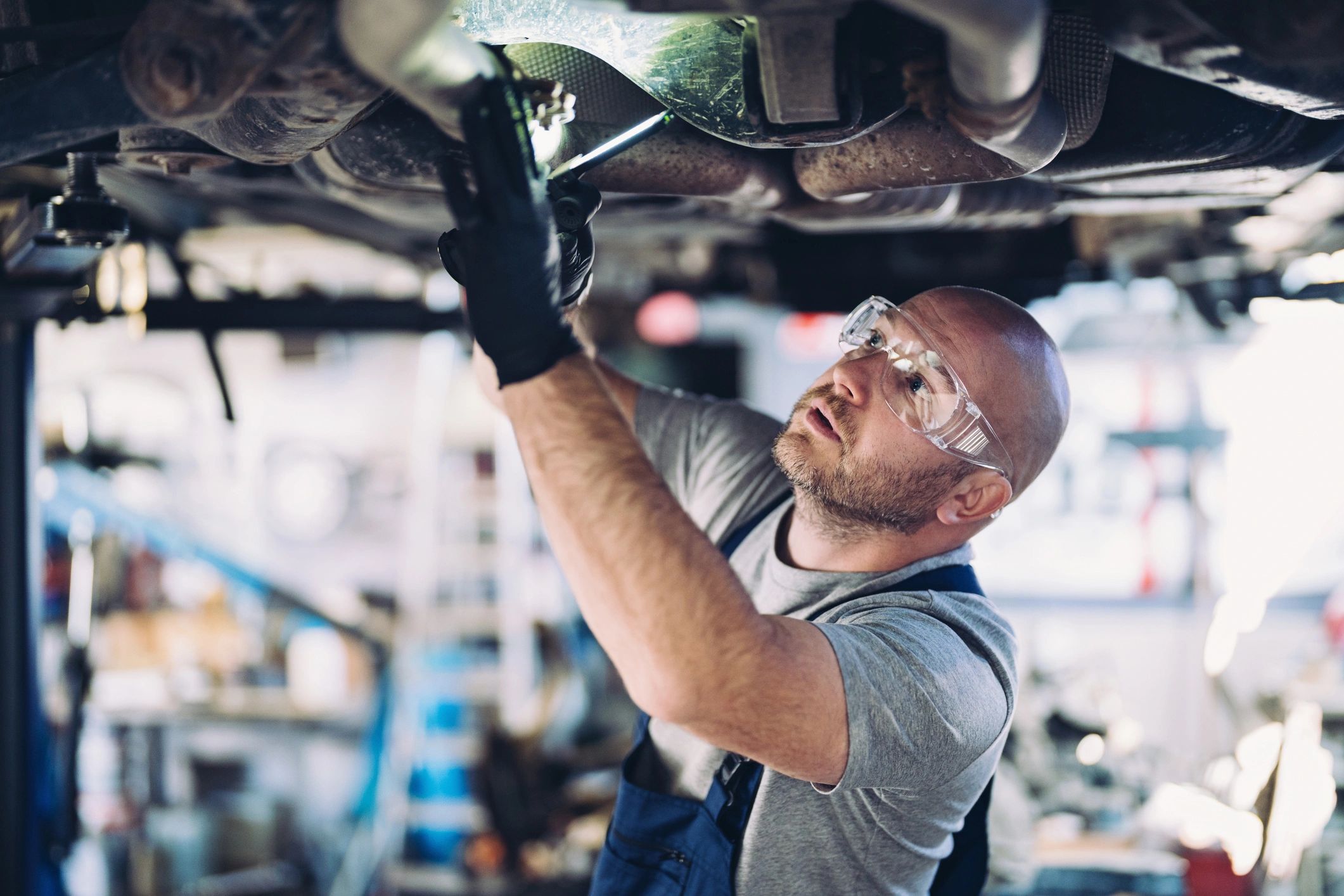 mechanic working on car engine