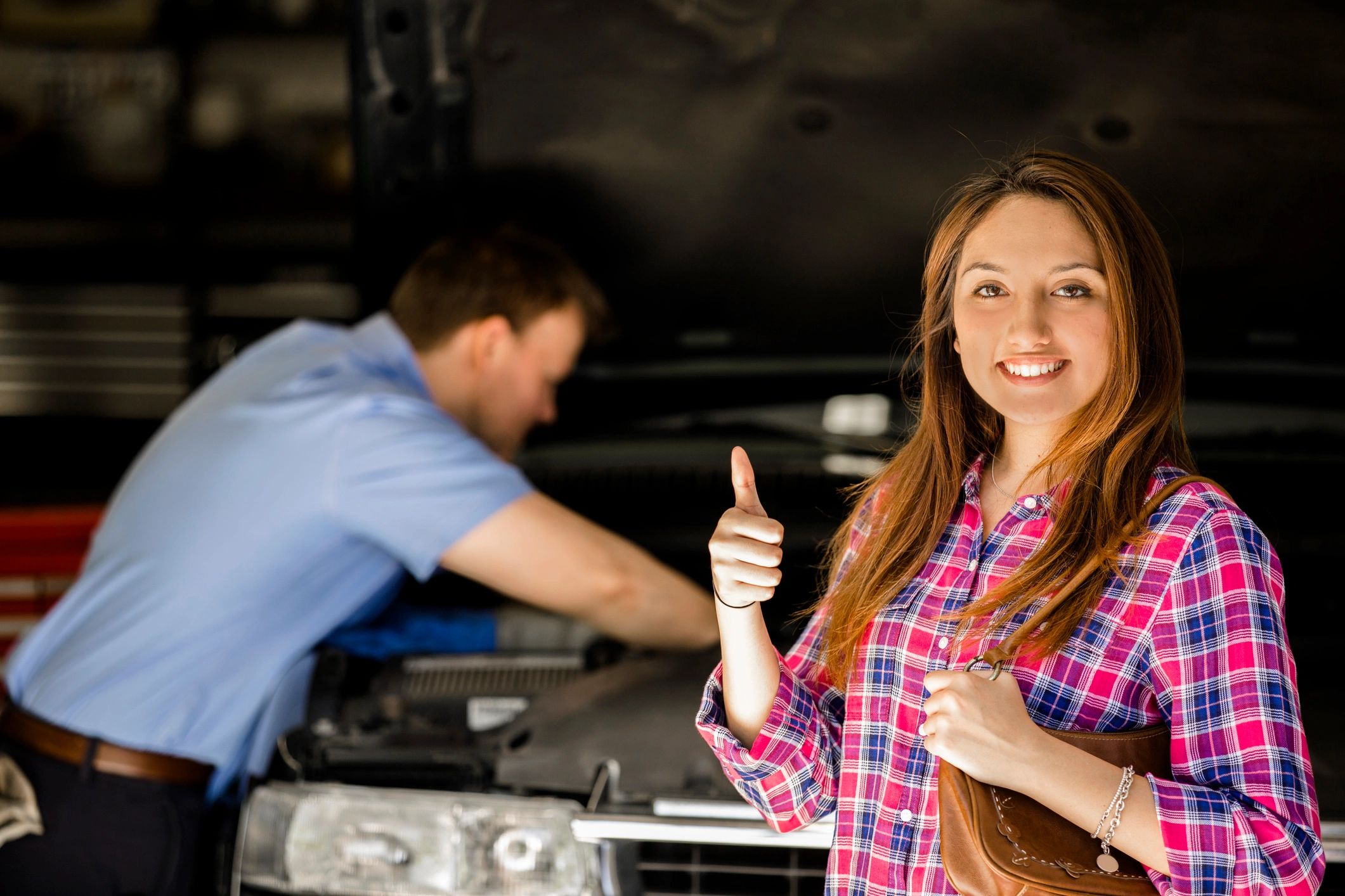 Satisfied car owner at repair shop