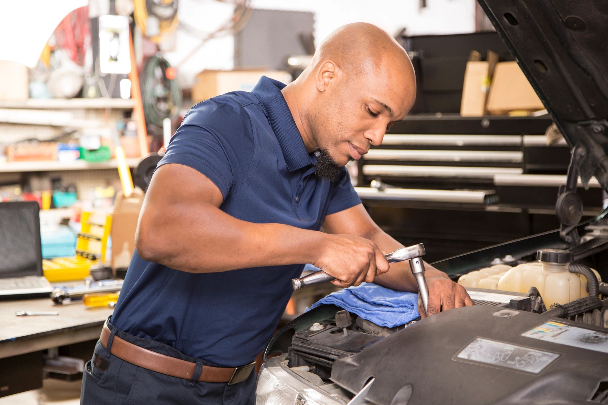 ASE certified mechanic working on car